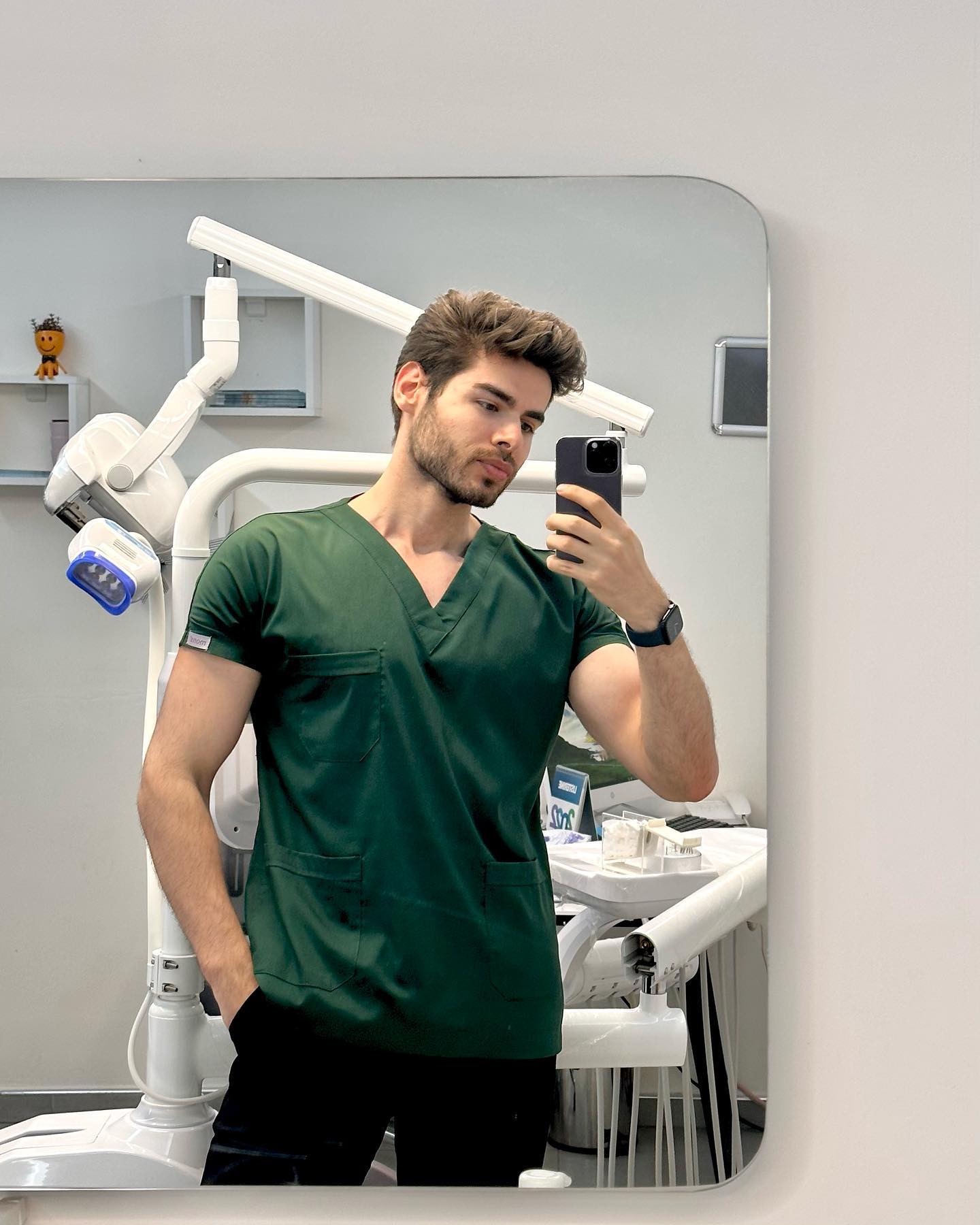 Dr Furkan Akar in clinic scrubs